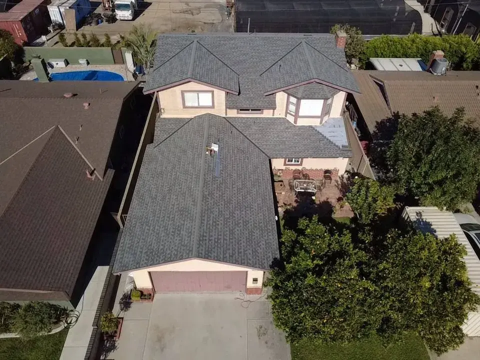 Aerial view of a gray shingle roof on a two-story home