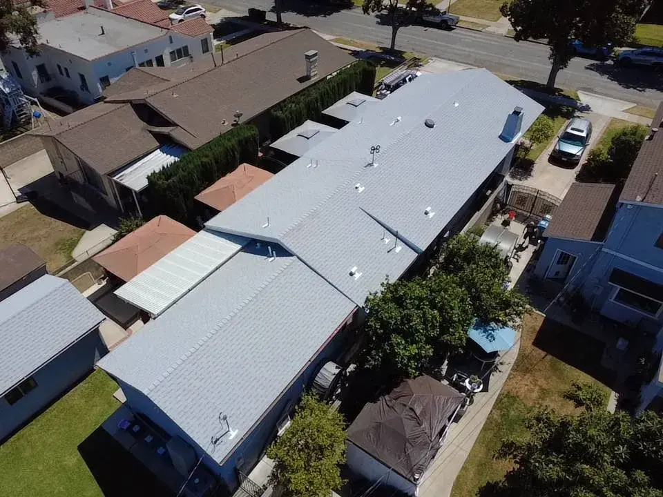 Aerial view of light gray roofs on neighboring houses
