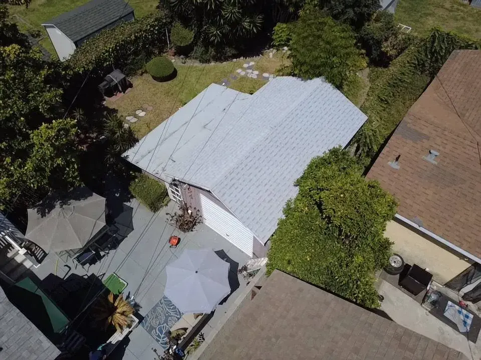 Aerial view of a light gray shingle roof on a house