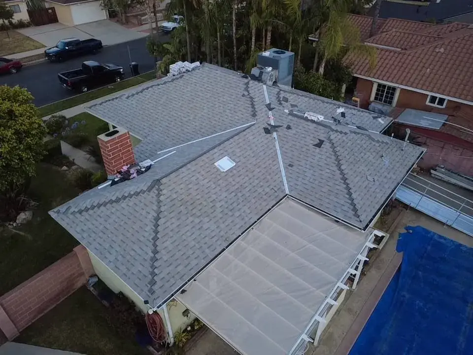 Aerial view of a gray shingle roof on a single-story home