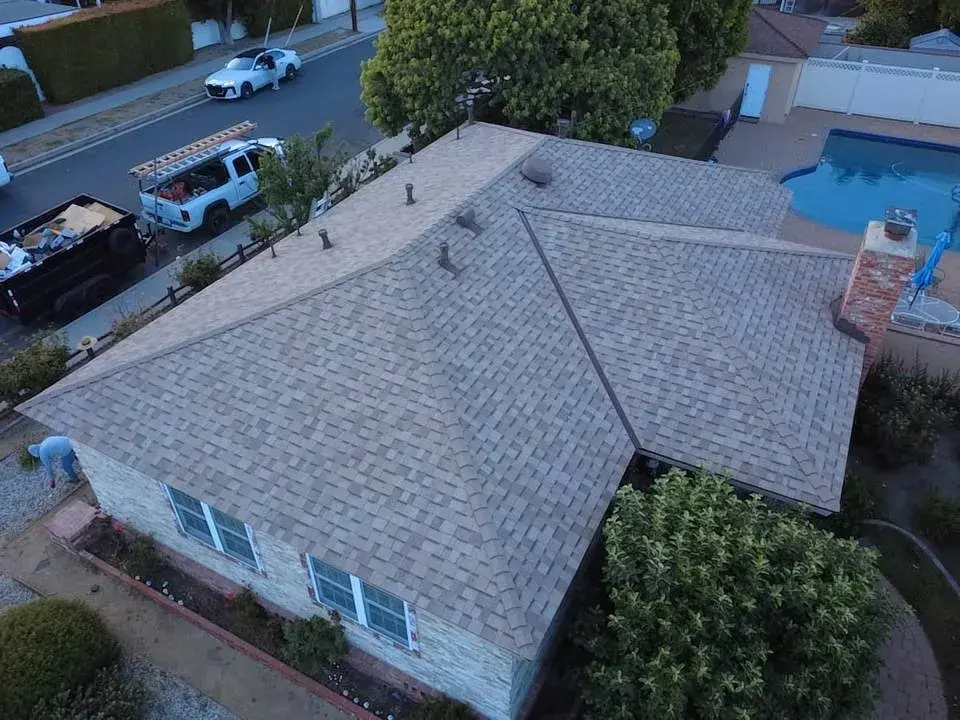 Aerial view of a new shingle roof on a single-story home