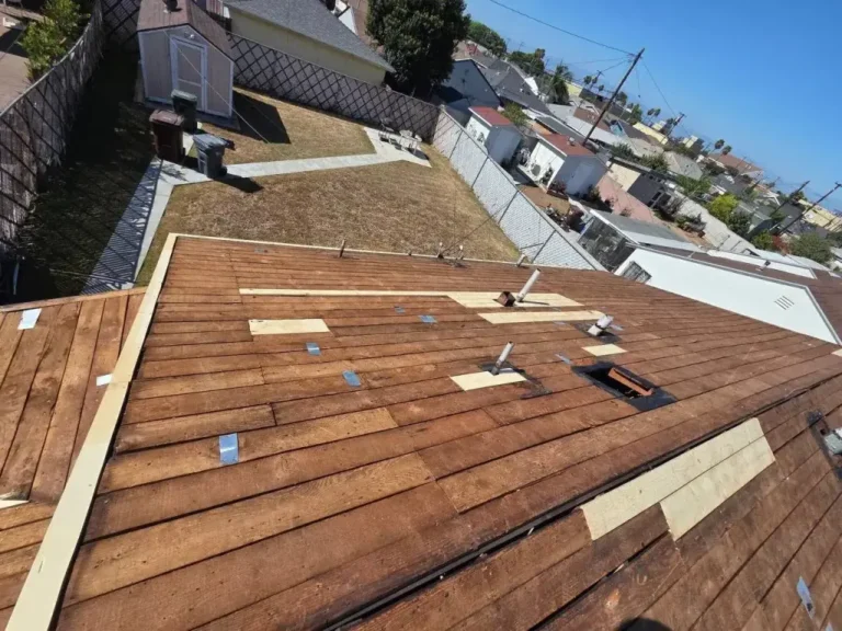Roof tear-off down to the original wood board decking